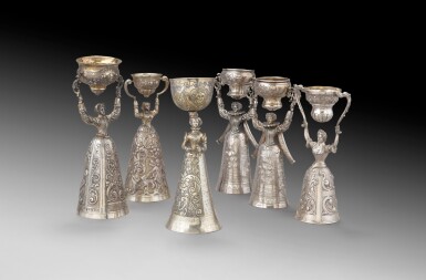 View full screen - View 1 of Lot 47. A group of six silver wedding cups in the style of the 17th century, Germany, circa 1900 | Groupe de six coupes de mariage en argent dans le style du XVIIe siècle, Allemagne, vers 1900.