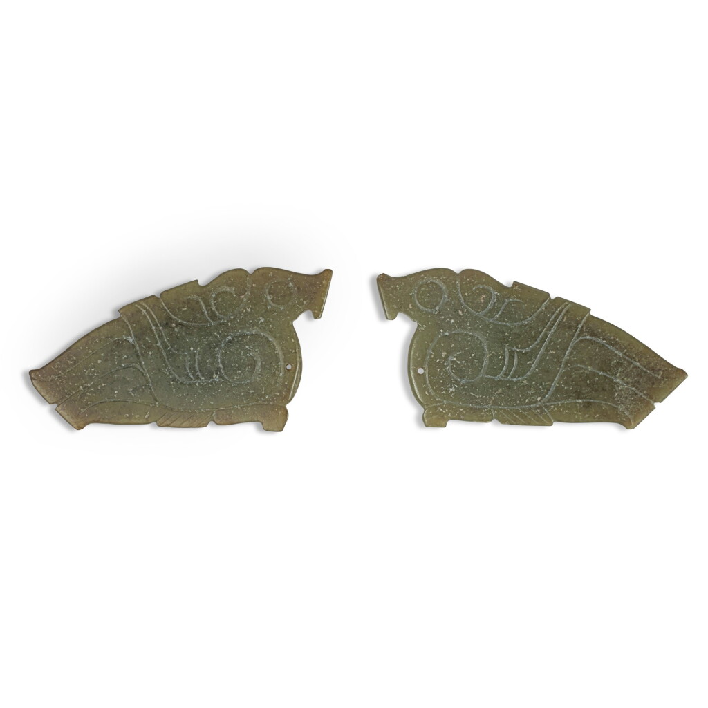 View full screen - View 1 of Lot 34. A pair of small green jade bird-form pendants, Western Zhou dynasty | 西周 玉鳥形飾一對.