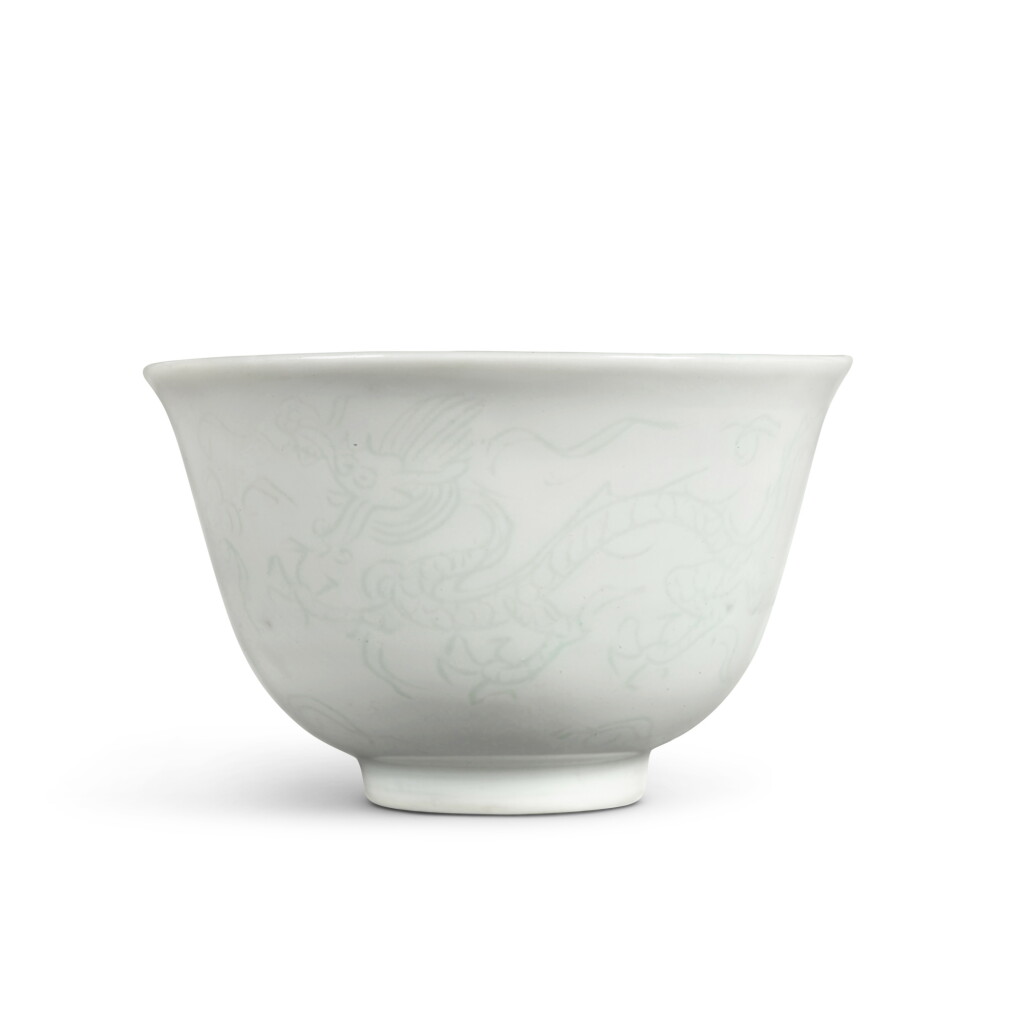 View full screen - View 1 of Lot 110. A fine incised white-glazed 'dragon' cup, Mark and period of Jiajing.