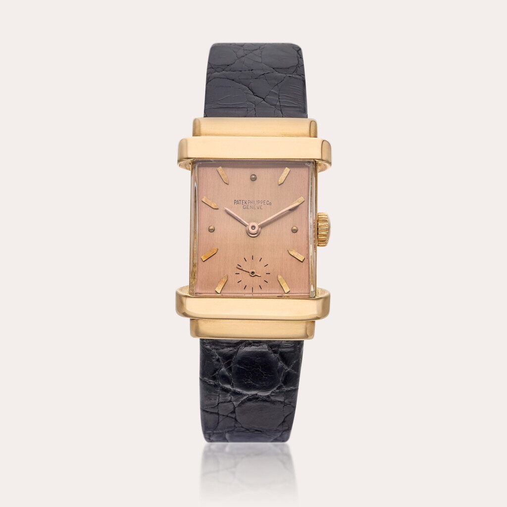 View full screen - View 1 of Lot 466. Reference 1450 ‘Top Hat Pink on Pink' | A pink gold rectangular wristwatch with pink dial, Circa 1945.