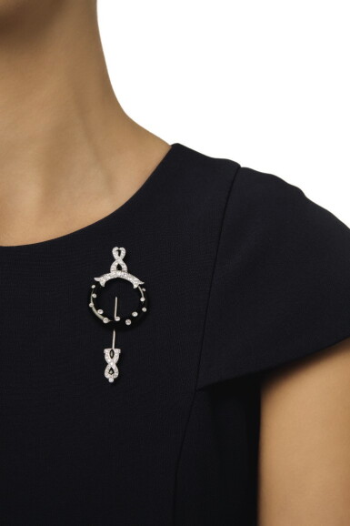 View full screen - View 1 of Lot 16. CARTIER | ONYX AND DIAMOND JABOT PIN.