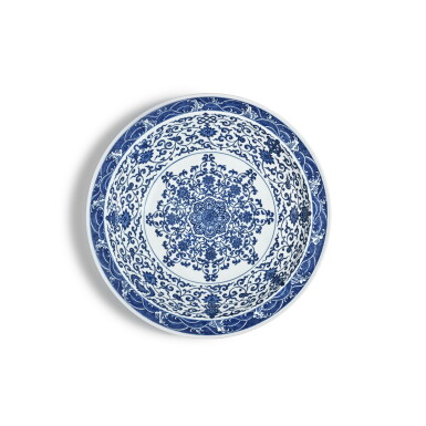 View full screen - View 1 of Lot 147. A large blue and white 'eight Buddhist emblems' dish, Mark and period of Yongzheng | 清雍正 青花寶相花蓮托八吉祥紋折沿大盤 《大清雍正年製》款.
