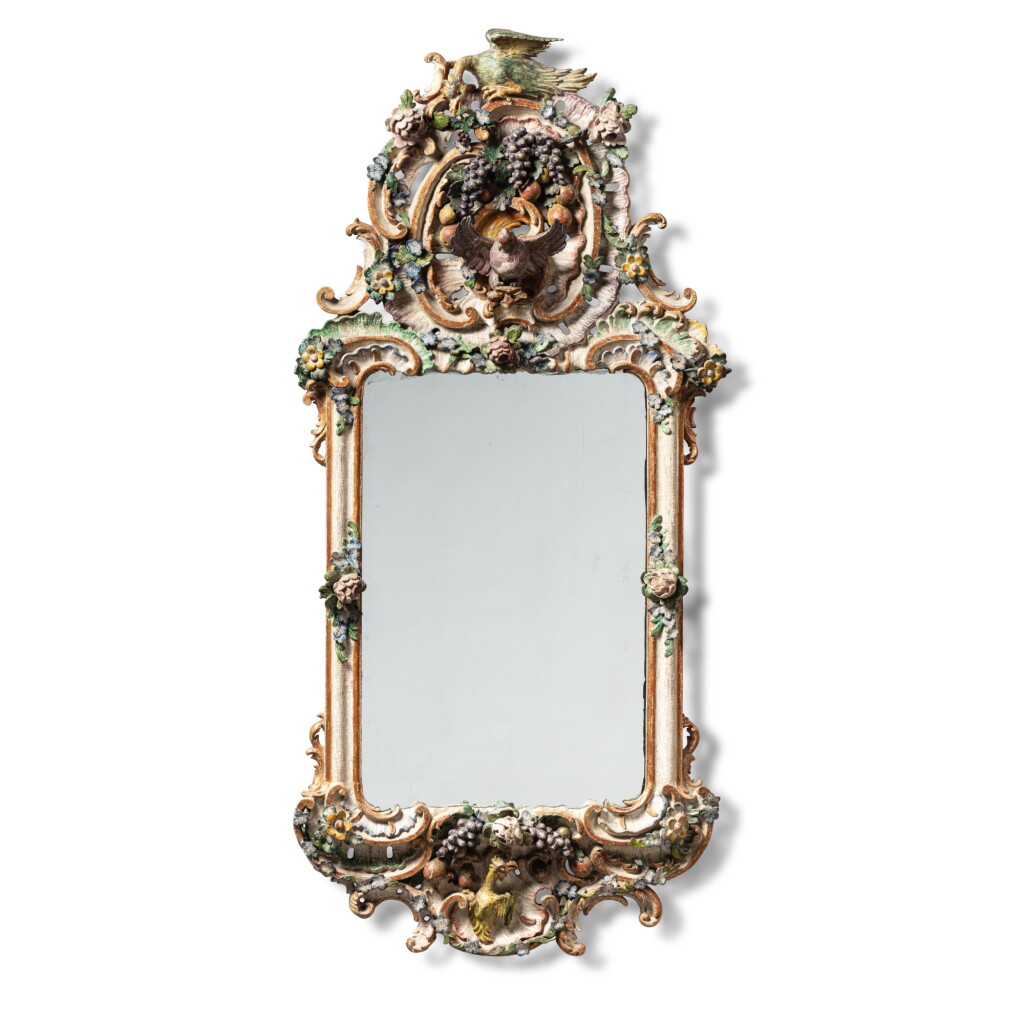 View full screen - View 1 of Lot 517. A South German carved polychrome-painted mirror, probably Bayreuth, circa 1750-1760.