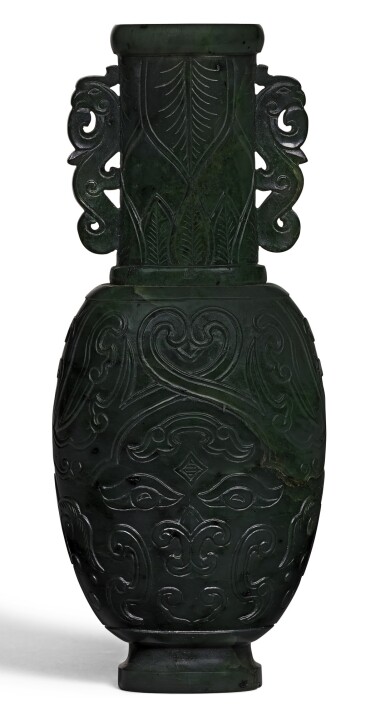 View full screen - View 1 of Lot 118. A SMALL SPINACH-GREEN JADE ARCHAISTIC VASE QING DYNASTY, 18TH/19TH CENTURY | 清十八/十九世紀 碧玉饕餮紋夔鳳耳瓶.