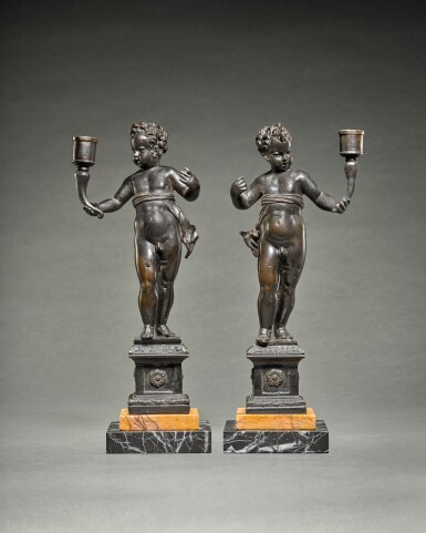 View full screen - View 1 of Lot 239. Pair of candlebearing Putti.
