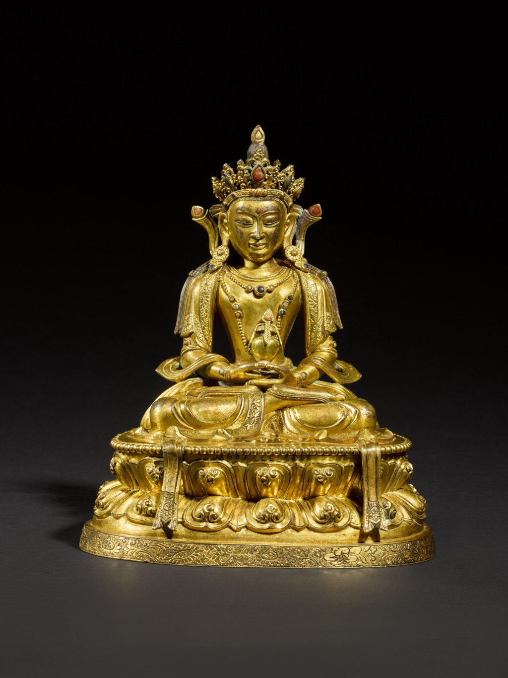 View full screen - View 1 of Lot 177. A well-cast gilt-bronze figure of Amitayus, Qing Dynasty, Kangxi period | 清康熙 鎏金銅無量壽佛坐像.