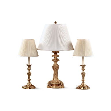 View full screen - View 1 of Lot 567. A Pair of Louis XV Style Gilt-Bronze Candlesticks Now Mounted as Lamps, Together with a Louis XV Style Candlestick Now Mounted as a Lamp.