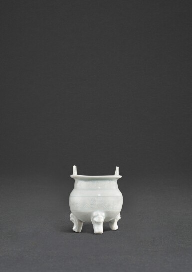 View full screen - View 1 of Lot 42. A miniature qingbai incense burner, Yuan dynasty | 元 青白釉幾何紋沖天耳三足小爐.