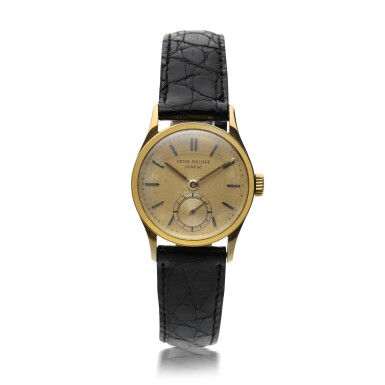 View full screen - View 1 of Lot 191. PATEK PHILIPPE | REFERENCE 448 A YELLOW GOLD WRISTWATCH, CIRCA 1950.