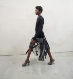 PRADA | OPEN PLEATS WOOL SKIRT, CASHMERE SWEATER, PRINTED SHIRT, POPLIN TIE, WORN BY LAURA REYES