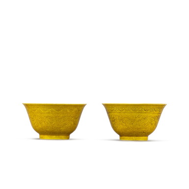 View full screen - View 1 of Lot 396. A pair of yellow-glazed incised 'dragon' bowls Marks and period of Guangxu | 清光緒 黃釉暗龍紋盌一對 《大清光緒年製》款.