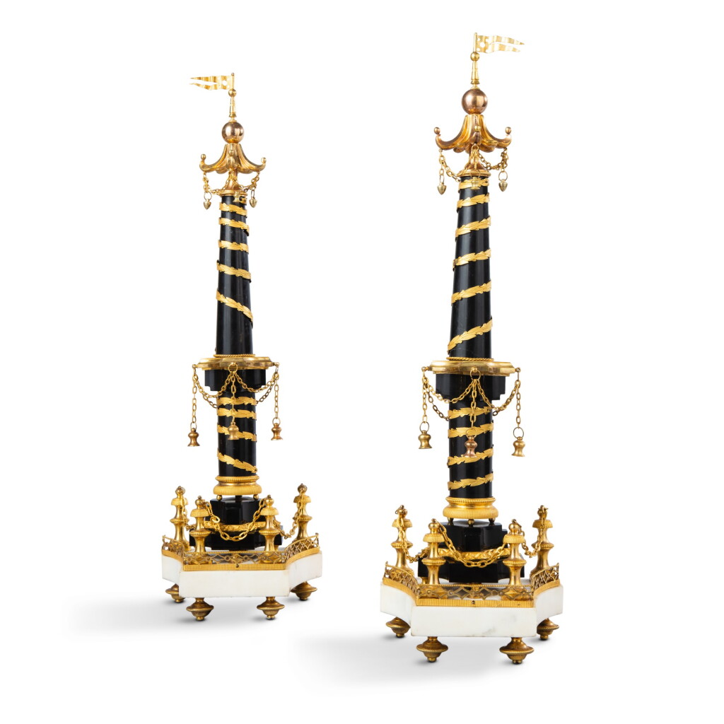 View full screen - View 1 of Lot 557. A pair of black and white marble and gilt-bronze ornamental columns, late Louis XVI, early 19th century.