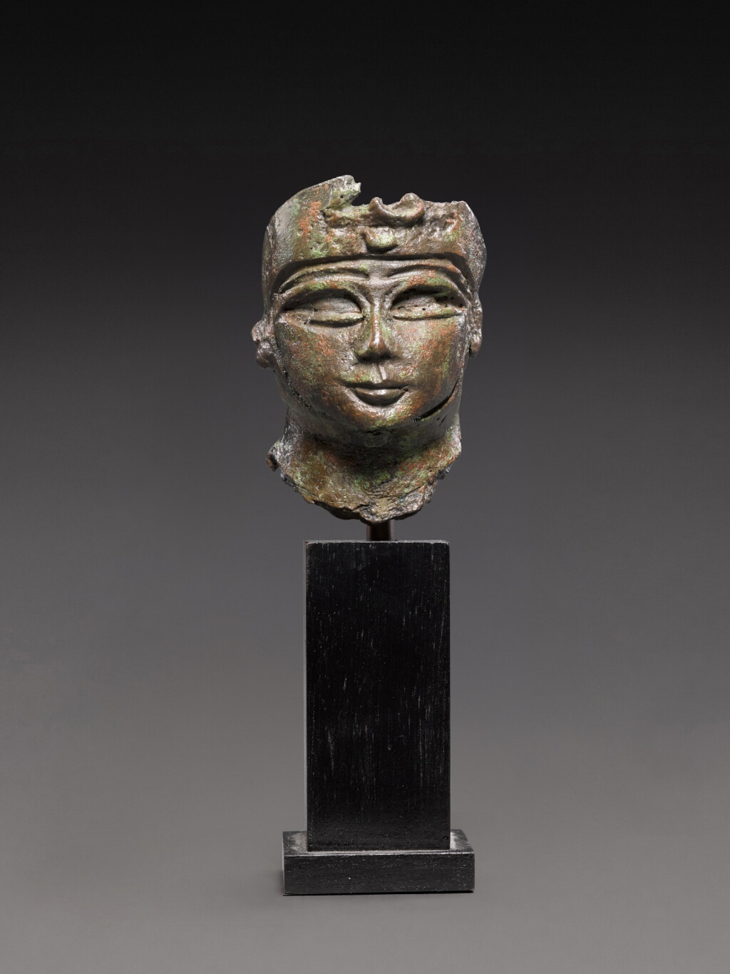View full screen - View 1 of Lot 119. An Egyptian Bronze Head of a Divinity or Ruler, 21st/22nd Dynasty, 1080-720 B.C..
