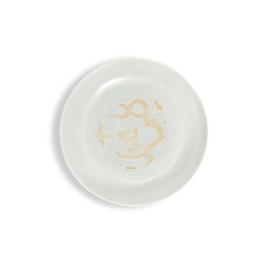 View full screen - View 1 of Lot 501. A rare incised white-glazed biscuit 'dragon' dish, Mark and period of Hongzhi | 明弘治 白釉素胎雲龍趕珠紋盤 《大明弘治年製》款.