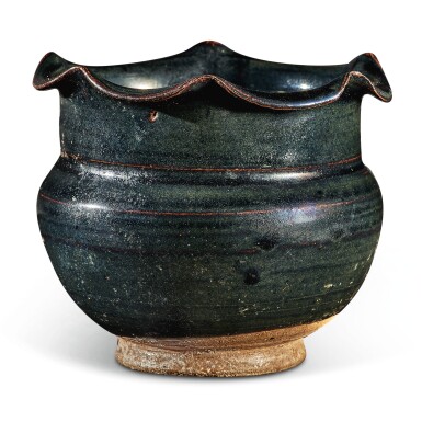 View full screen - View 1 of Lot 104. A rare black-glazed foliate-rimmed jar, Northern Song / Jin dynasty | 北宋 / 金 黑釉花口罐.