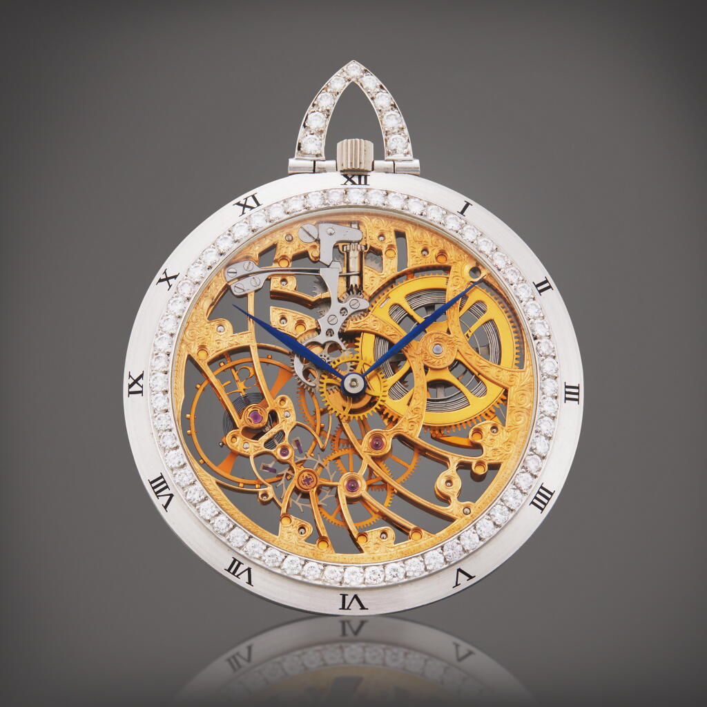 View full screen - View 1 of Lot 53. Reference 35656BC | A white gold and diamond-set skeletonized open faced watch, Circa 1976.