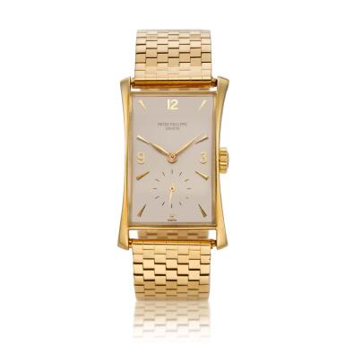 View full screen - View 1 of Lot 248. Reference 1593 'Hour Glass' A yellow gold rectangular wristwatch with bracelet, Made in 1949.