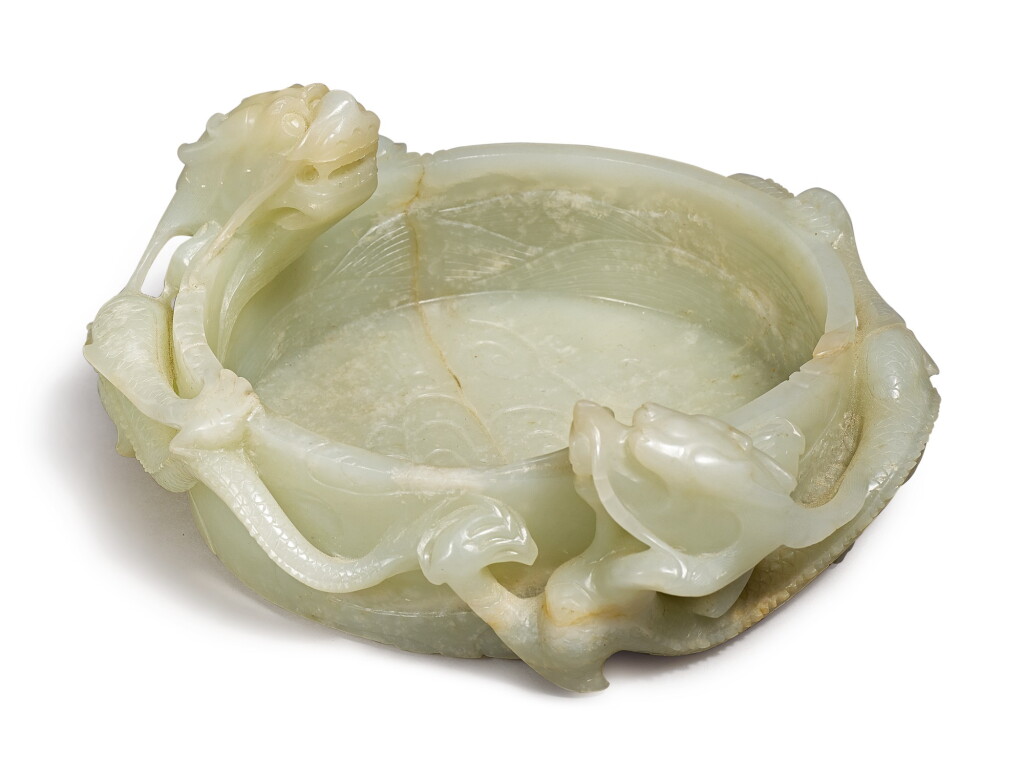 View full screen - View 1 of Lot 660. A celadon jade ‘dragon’ washer, Qing dynasty, 19th / early 20th century.