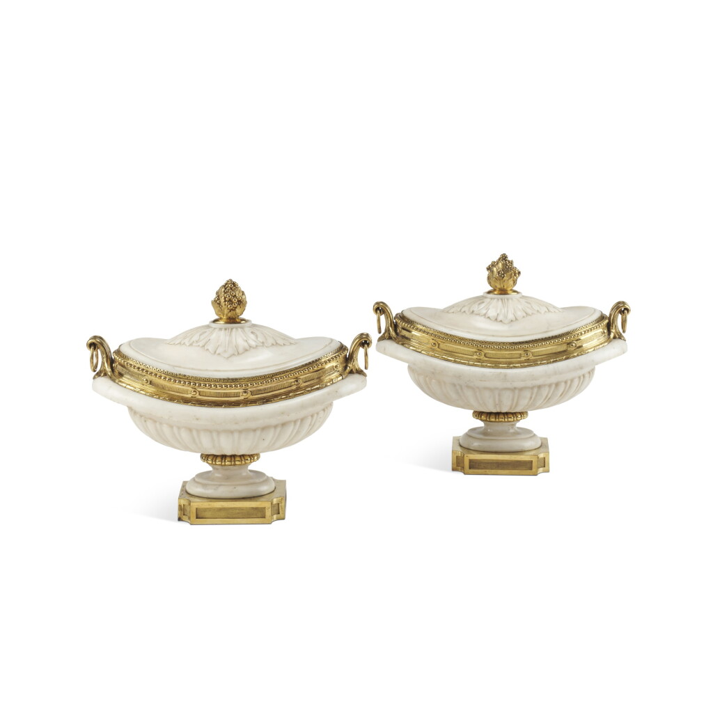 View full screen - View 1 of Lot 51. A pair of Louis XVI gilt-bronze mounted nacelle-shaped vases with covers, circa 1775.