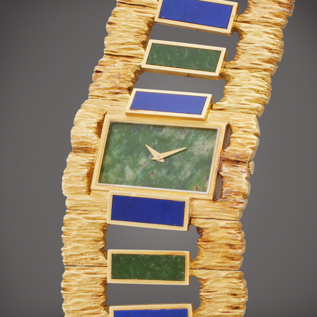 View full screen - View 1 of Lot 126. Reference 9212 D 76 | A yellow gold nephrite and lapis lazuli bracelet watch, Circa 1970.