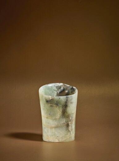 View full screen - View 1 of Lot 85. An archaic pale green and gray jade hoof-shaped ornament, Neolithic period, Hongshan culture .