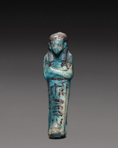 View full screen - View 1 of Lot 213. An Egyptian Turquoise Faience Ushabti, 20th/21st Dynasty, 1190-944 B.C..