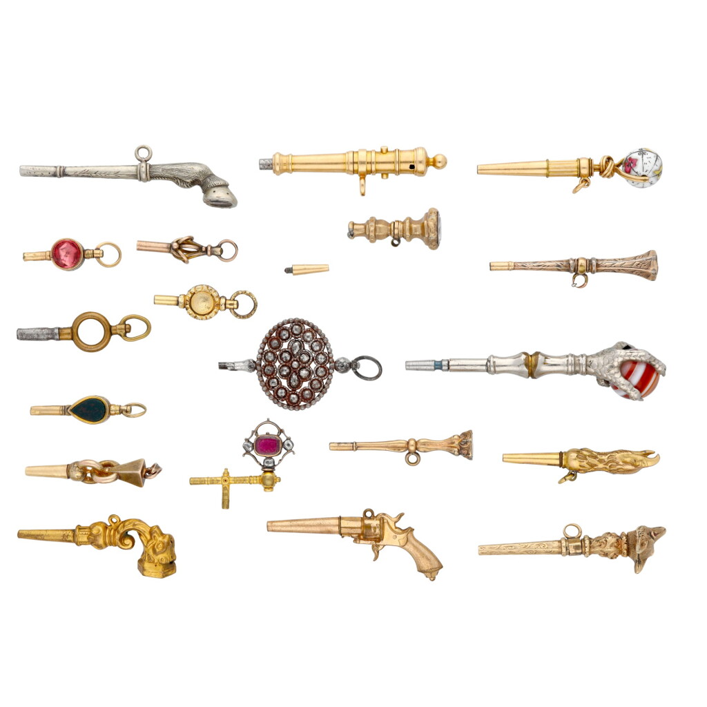 View full screen - View 1 of Lot 242. A group of 19 watch keys including animal forms and a key set with a globe 19th century.