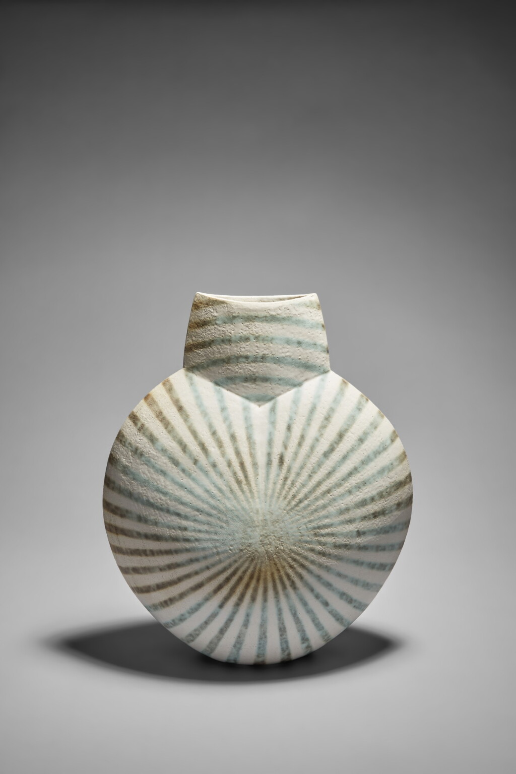 View full screen - View 1 of Lot 501. Large green and white disc pot with green banded design on white glaze.