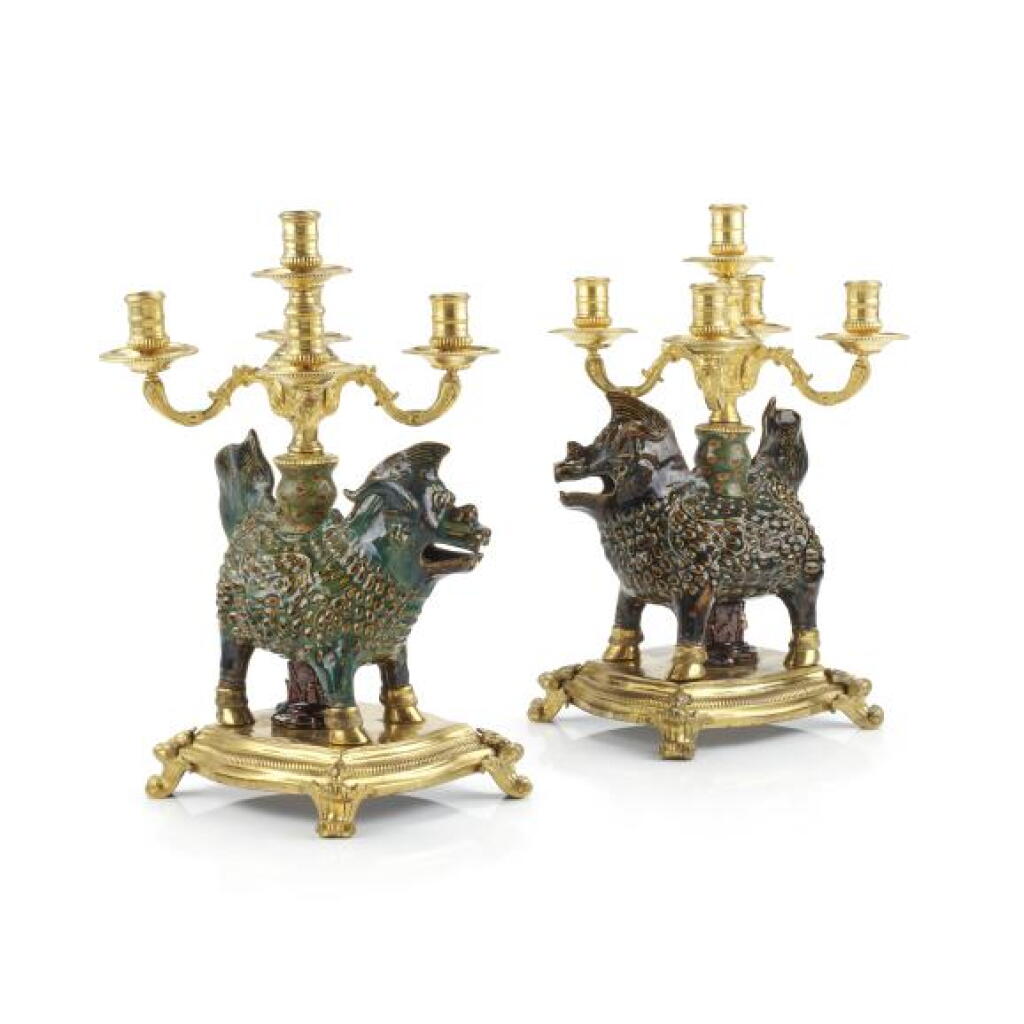View full screen - View 1 of Lot 21. A pair of Régence gilt-bronze mounted Chinese (Zhuang Zhou) glazed stoneware five-light Qilin dragon candelabra, the mounts circa 1720.