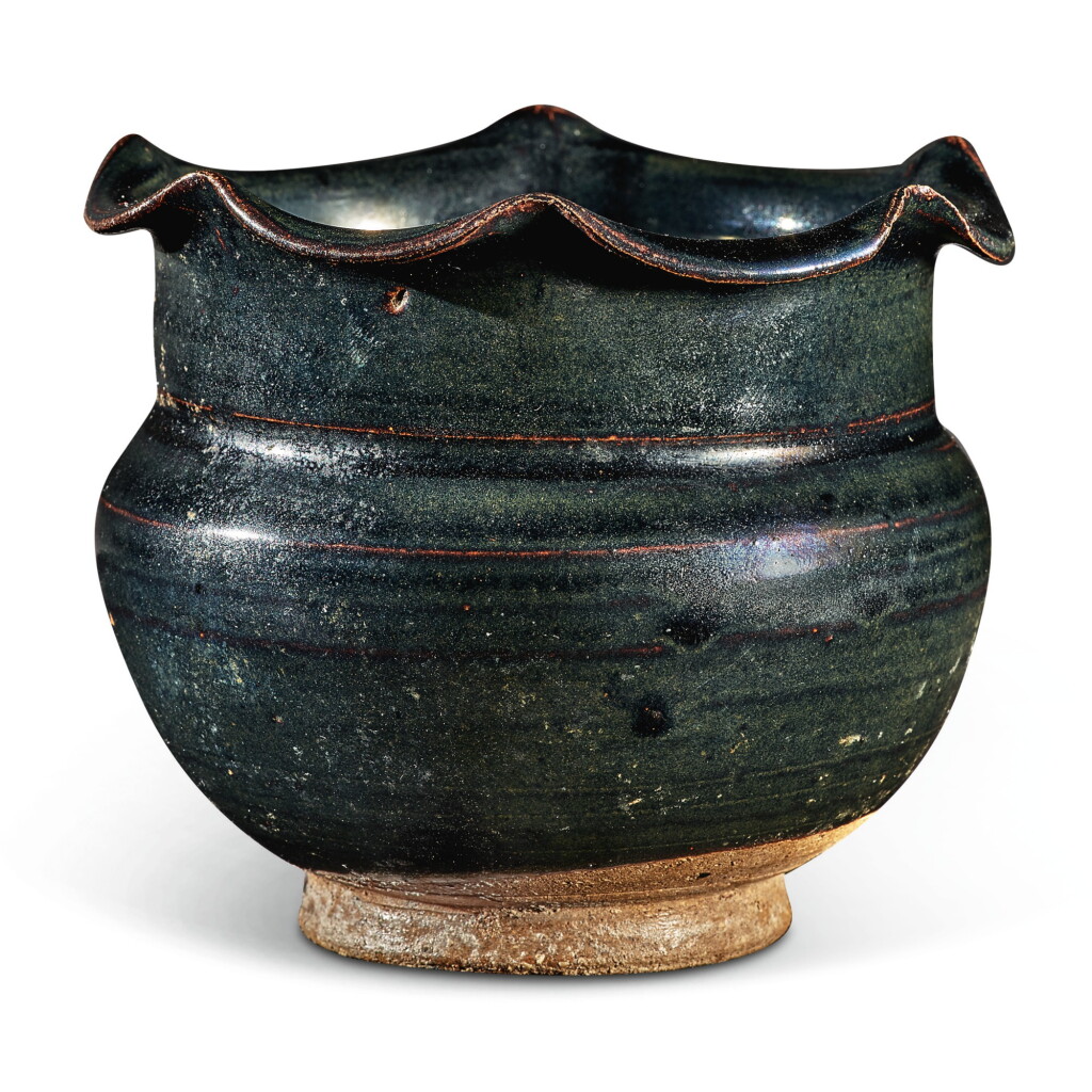 View full screen - View 1 of Lot 104. A rare black-glazed foliate-rimmed jar, Northern Song / Jin dynasty | 北宋 / 金 黑釉花口罐.