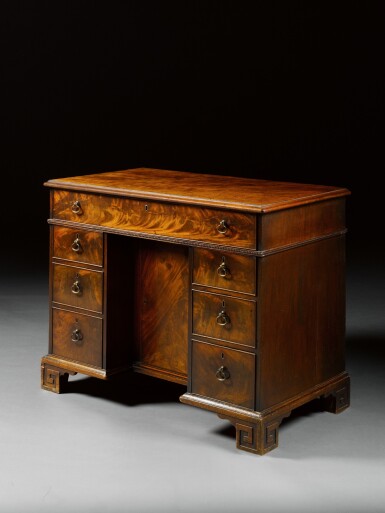 View full screen - View 1 of Lot 12. A George III mahogany kneehole desk by Thomas Chippendale, 1774.
