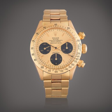 View full screen - View 1 of Lot 19. Reference 6265 Daytona | Retailed by Tiffany & Co.: A yellow gold chronograph wristwatch with bracelet, Circa 1978.