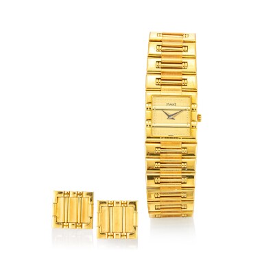 View full screen - View 1 of Lot 1105. PIAGET | DANCER, REFERENCE 81317 K81 A YELLOW GOLD BRACELET WATCH WITH A PAIR OF ASSOCIATED CUFFLINKS, CIRCA 1990.