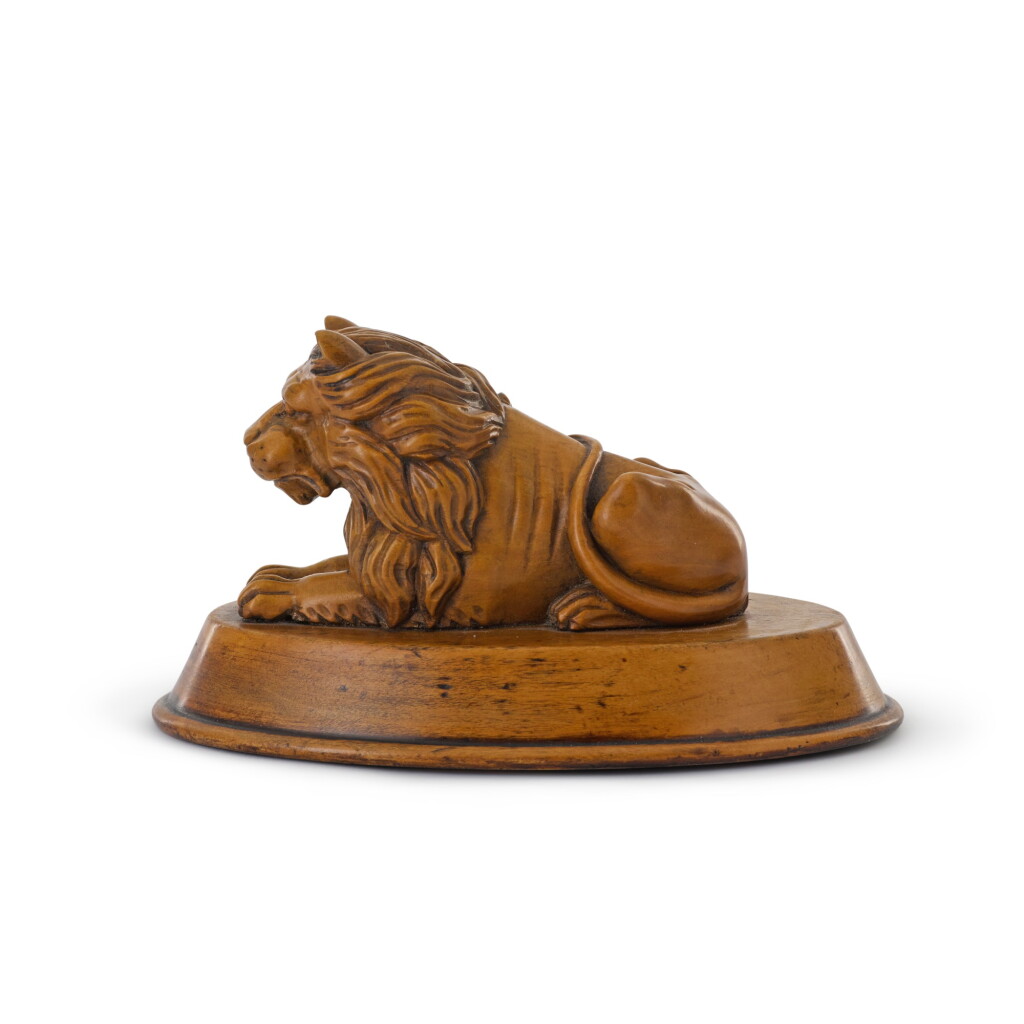 View full screen - View 1 of Lot 105. A REGENCY CARVED BOXWOOD MODEL OF A LION, SECOND QUARTER 19TH CENTURY.