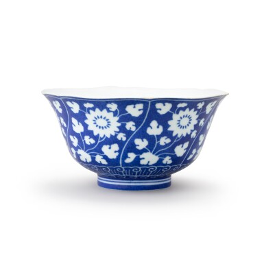 View full screen - View 1 of Lot 16. A reversed-decorated blue and white ‘chrysanthemum' bowl Mark and period of Yongzheng | 清雍正 灑藍地留白菊花紋盌 《大清雍正年製》款.