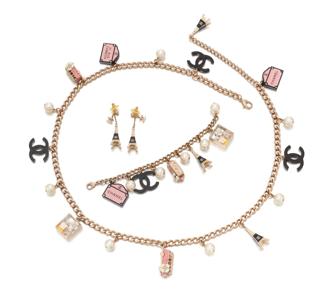 View full screen - View 1 of Lot 19. Collection of faux pearl and 'Paris Souvenirs' charm costume jewelry.