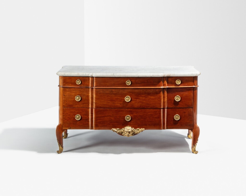 View full screen - View 1 of Lot 119. A Louis XV gilt-bronze mounted mahogany commode, circa 1760-1765, stamped Simon Oeben.
