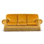 A yellow velvet covered three-seat sofa, modern