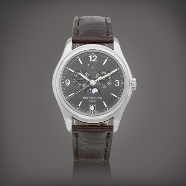 View full screen - View 1 of Lot 711. Reference 5146 | A white gold annual calendar wristwatch with moon phases and power reserve indication, Retailed by Tiffany & Co., Circa 2014 | 百達翡麗 | 型號5146 | 白金年曆腕錶,備月相及動力儲備顯示,由 Tiffany & Co. 發行,約2014年製.