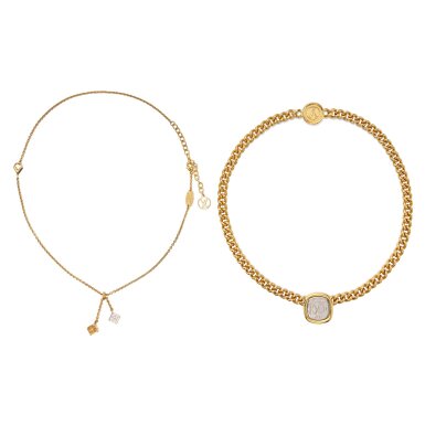 View full screen - View 1 of Lot 323. Gilt-Metal 'Lucky Gram' and 'ID LV' Pendant-Necklaces.