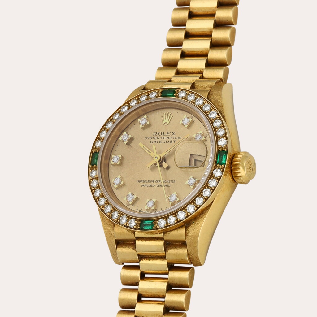 View full screen - View 1 of Lot 324. Lady Datejust, Reference 69078 | A yellow gold, emerald- and diamond-set wristwatch with date and bracelet | Circa 1988.