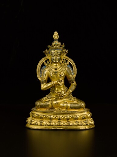 View full screen - View 1 of Lot 43. A gilt-copper alloy figure of Vajrasattva Tibet, 14th century | 西藏 十四世紀 鎏金銅合金金剛薩埵坐像.