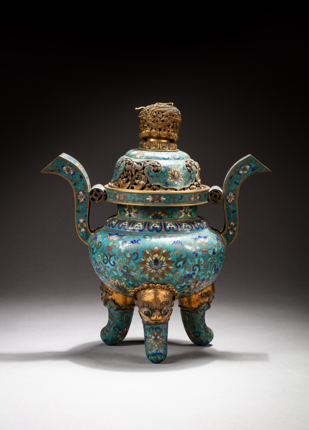 View full screen - View 1 of Lot 138. A gilt-bronze and cloisonné enamel tripod incense burner and cover, Qing dynasty, 18th-19th century | 清十八至十九世紀 掐絲琺瑯纏枝蓮紋朝冠耳三足爐配蓋.