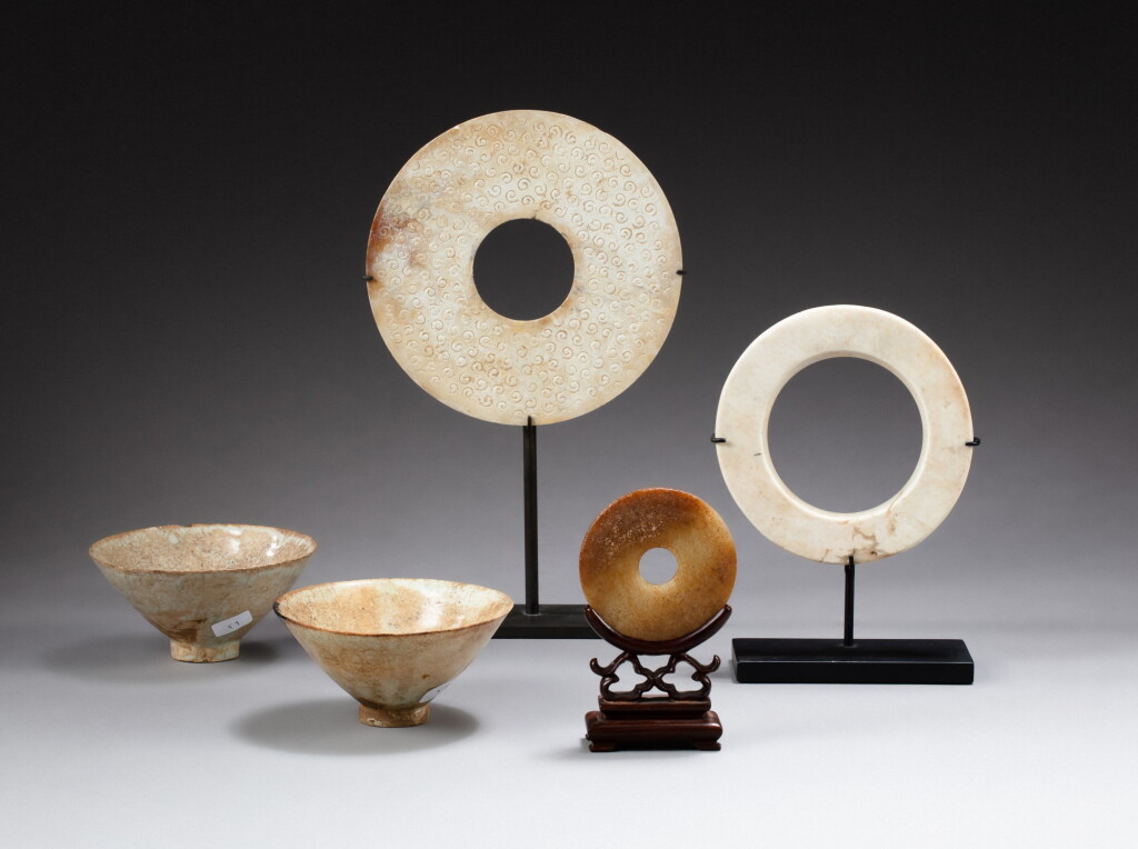 View full screen - View 1 of Lot 157. Three archaistic jade discs and two straw-glazed wine cups, Qing dynasty and Song dynasty | 清 仿古玉器 及 宋 白釉盃 一組五件.