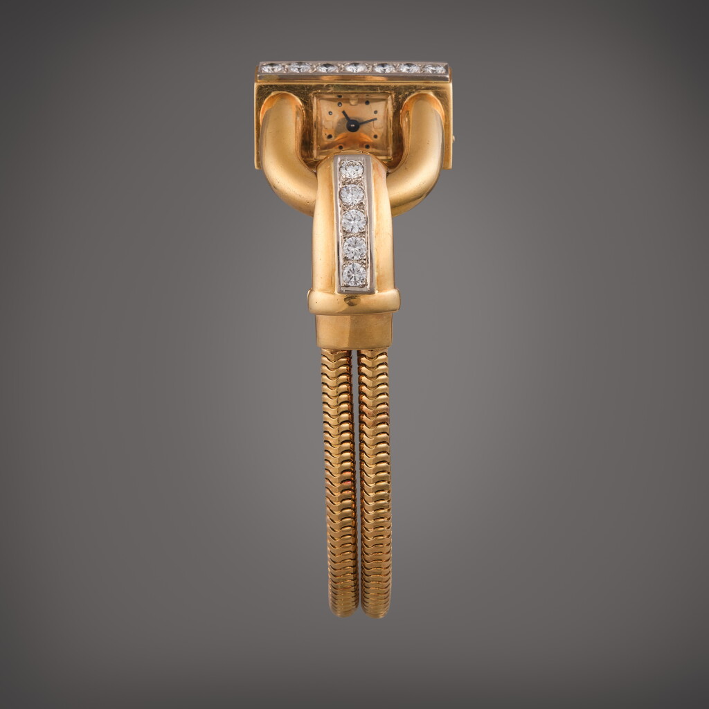 View full screen - View 1 of Lot 400. Cadenas | A yellow gold and diamond-set wristwatch with bracelet, Circa 1950.