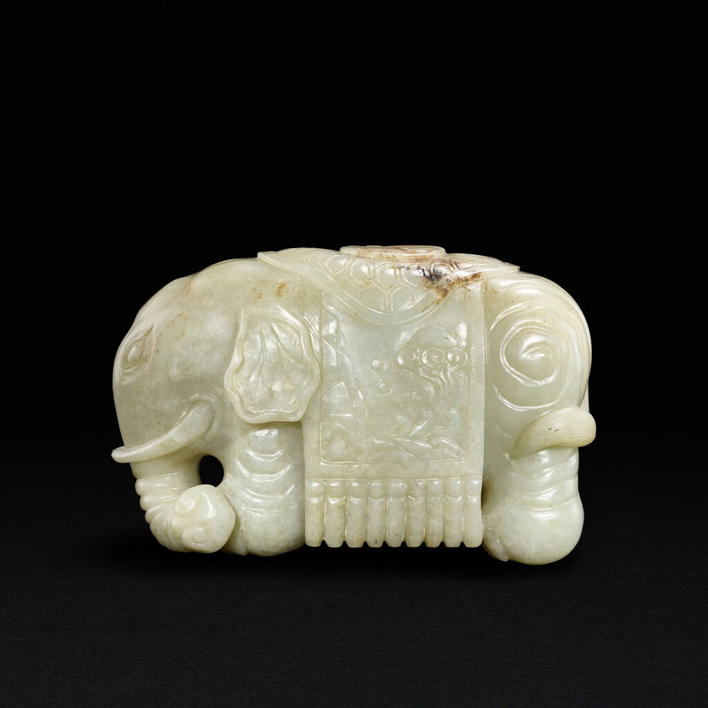 View full screen - View 1 of Lot 692. A greyish celadon jade elephant, Ming dynasty | 明 青灰玉寶象.