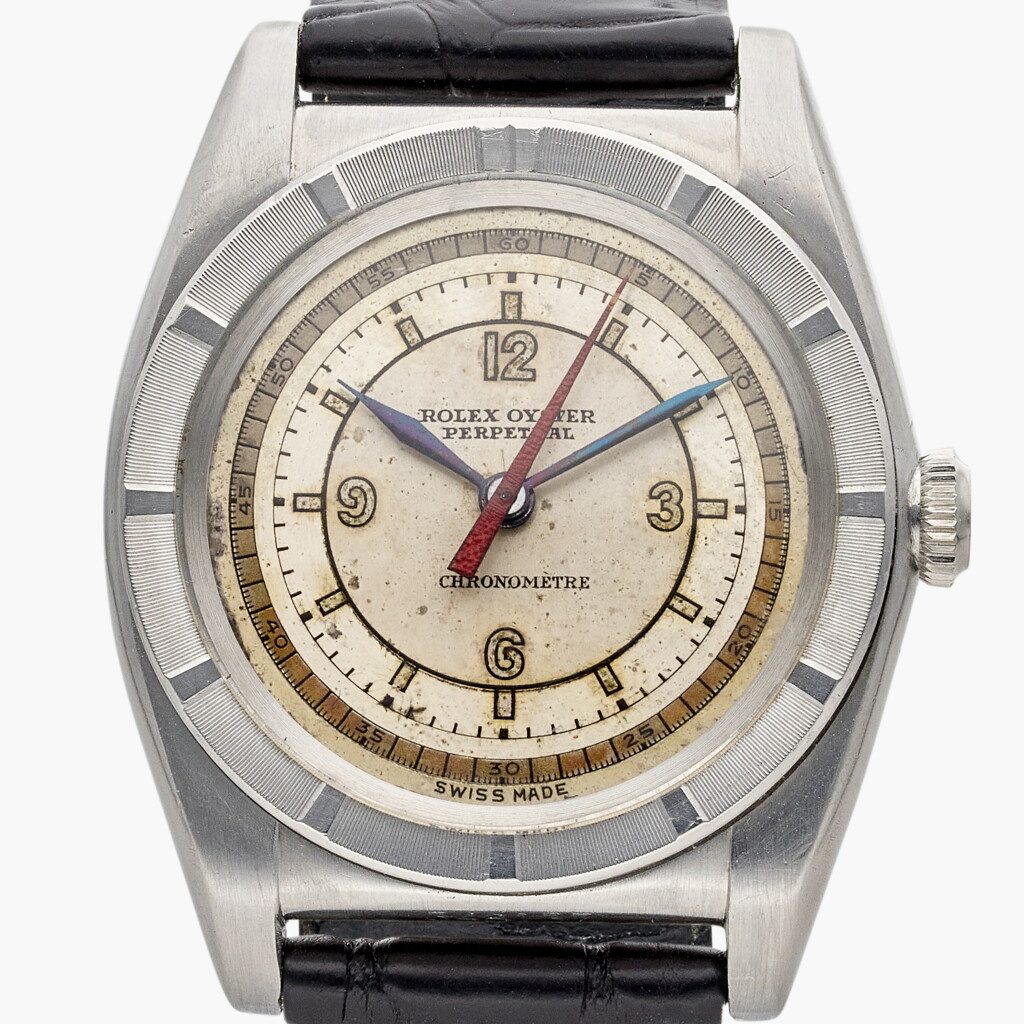 View full screen - View 1 of Lot 553. Reference 2940 'Bubbleback' | A stainless steel automatic wristwatch with sector dial and engine turn bezel, Circa 1946.