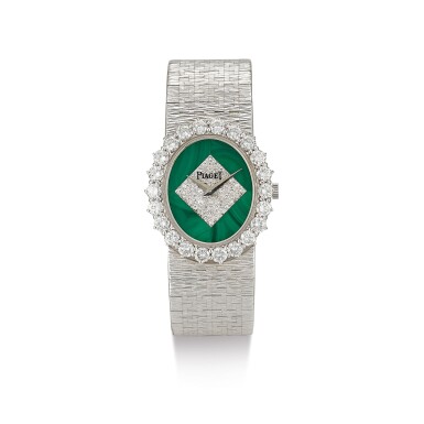 View full screen - View 1 of Lot 99. PIAGET | REFERENCE 9338A6, A WHITE GOLD AND DIAMOND-SET BRACELET WATCH WITH MALACHITE DIAL, CIRCA 1970.