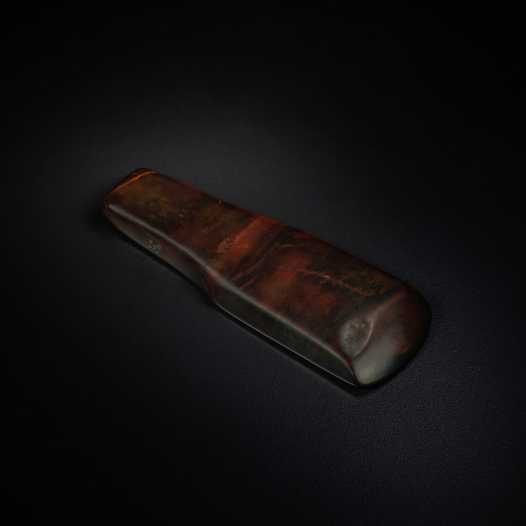 View full screen - View 1 of Lot 524. The Guennol imperially-inscribed archaic jade axe-adze, Neolithic period, 'Shi Quan Lao Ren Wan Yu' seal mark and period of Qianlong | 新石器時代 玉錛 《十全老人玩玉》款.