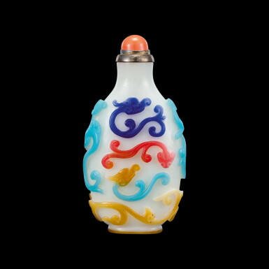 View full screen - View 1 of Lot 1061. A four-colour overlay white glass 'dragon' snuff bottle Qing dynasty, 18th - 19th century | 清十八至十九世紀 涅白地套四色龍紋鼻煙壺.
